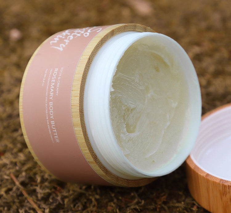 Rosemary Body Butter 3.4oz mini held in hand, post-shower plant-based skincare