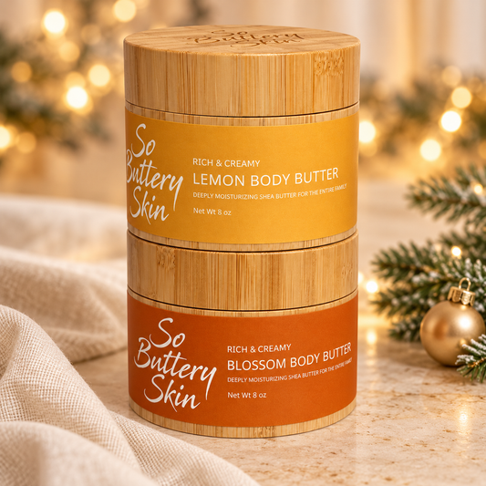 Holiday Glow Duo: Lemon jar stacked on Blossom jar beside pine and gold ornaments