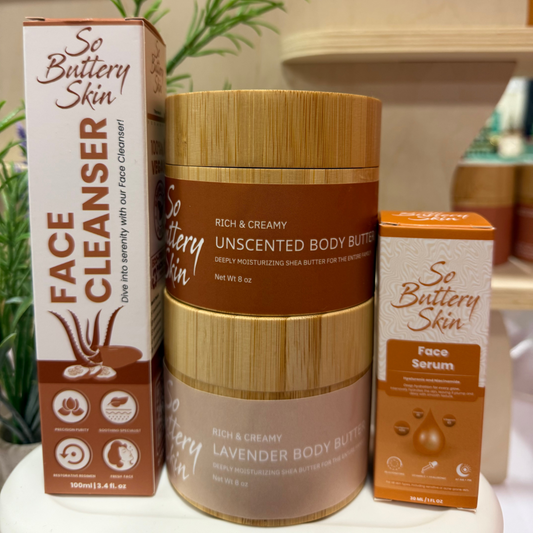 Collection of 'So Butterly Skin' skincare products including cleanser, body butter, and serum on a white surface.