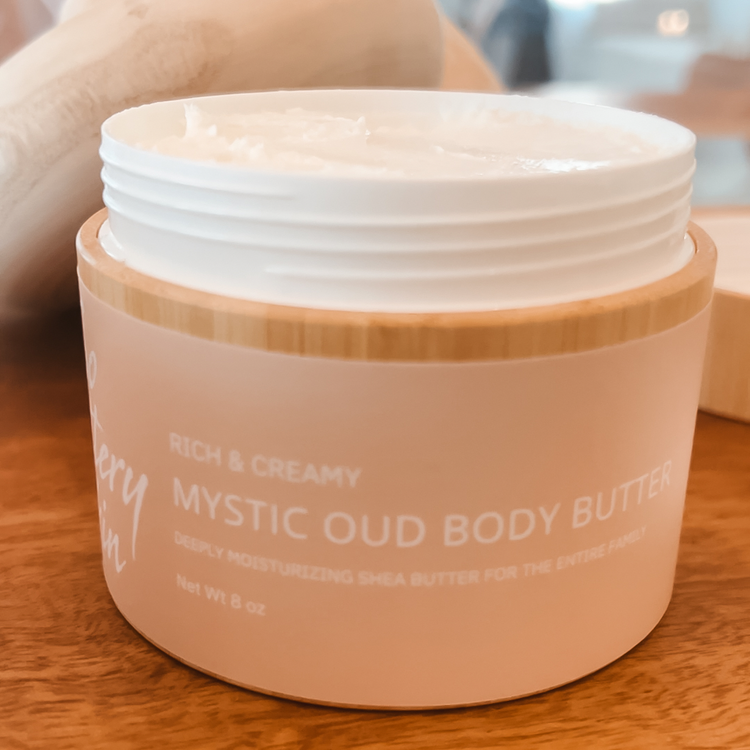 Open jar of Mystic Oud Body Butter with rich, whipped texture