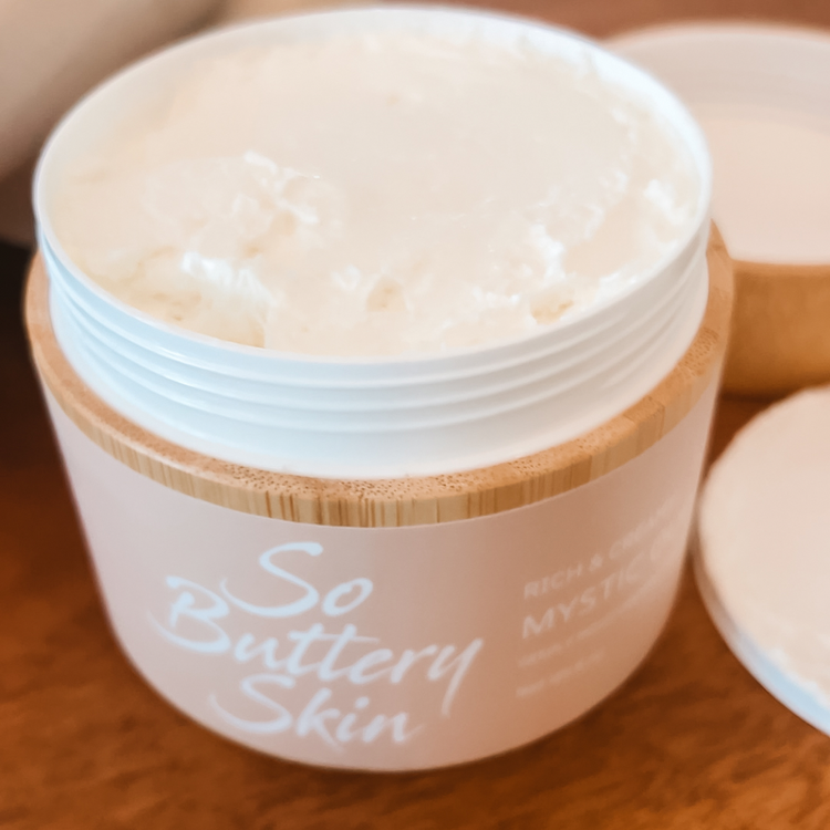 Open jar of Mystic Oud Body Butter with rich, whipped texture