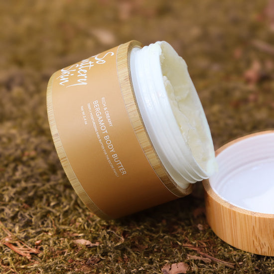 Bergamot Body Butter 3.4oz mini held in hand, carry-on skincare for dry sensitive skin