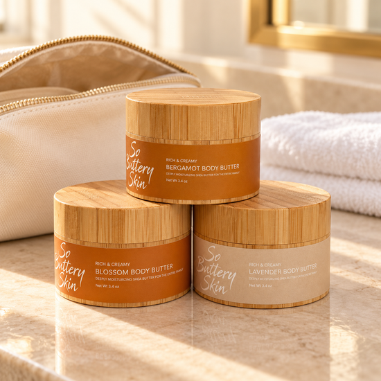 Travel size Body Butter Trio: Bergamot, Blossom and Lavender jars beside a canvas toiletry bag