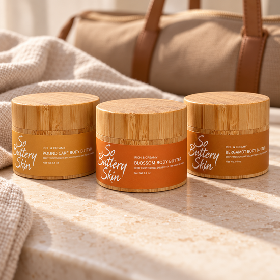 Travel size Pound Cake, Blossom and Bergamot Body Butter jars in front of a weekender bag