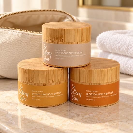 Travel size Body Butter Trio: Mystic Oud, Pound Cake and Blossom jars beside a toiletry bag