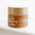 Product beside calming, neutral-toned elements